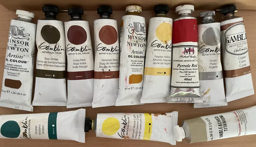An array of oil paints in 37mL tubes.